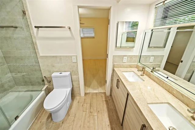 a view of an entryway with wooden floor