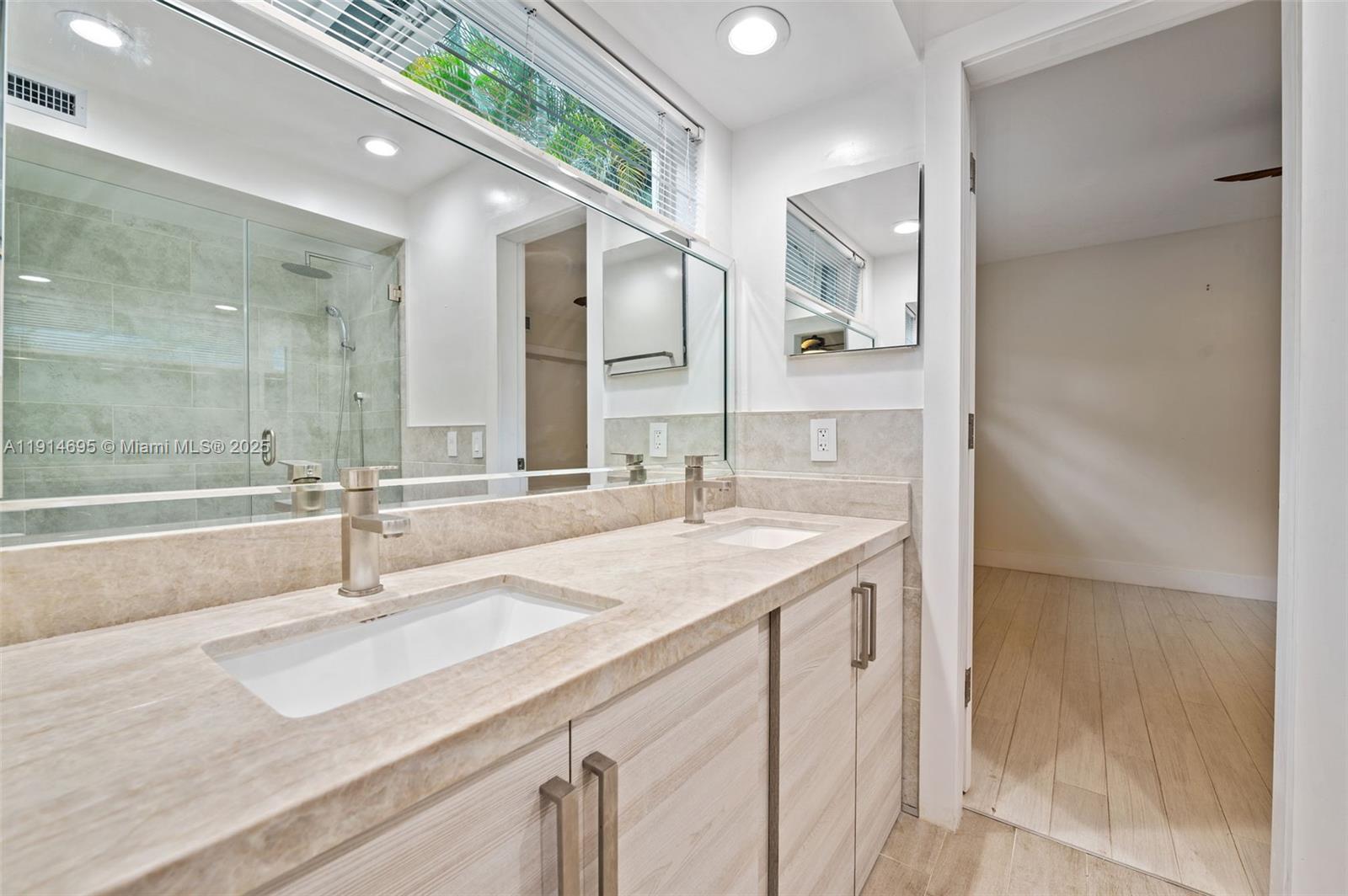 2015 Northeast 120th Road North Miami, FL 33181 - Photo 36 of 67 a bathroom with a sink and a mirror