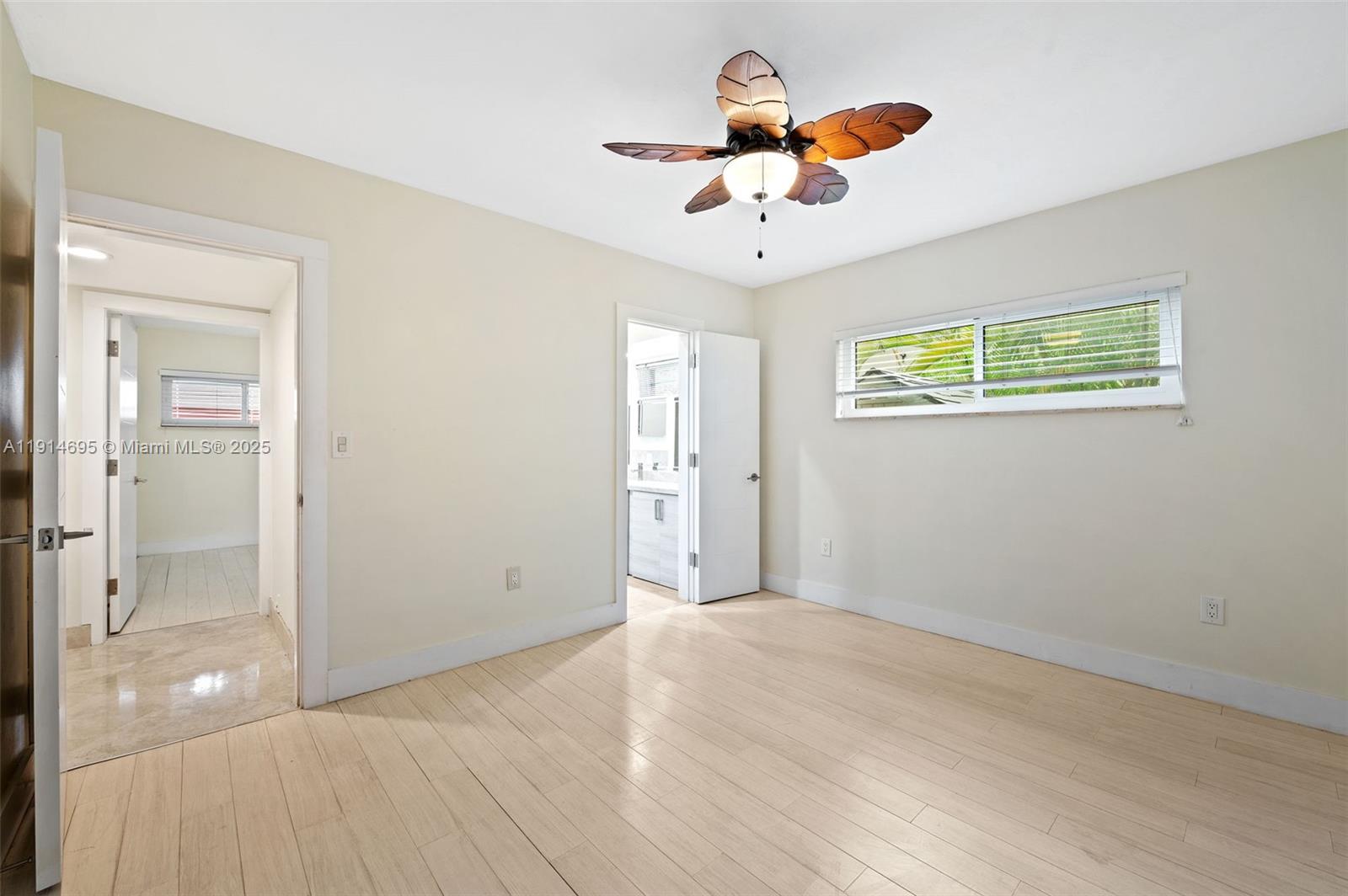 2015 Northeast 120th Road North Miami, FL 33181 - Photo 37 of 67 wooden floor in an empty room with a chandelier fan