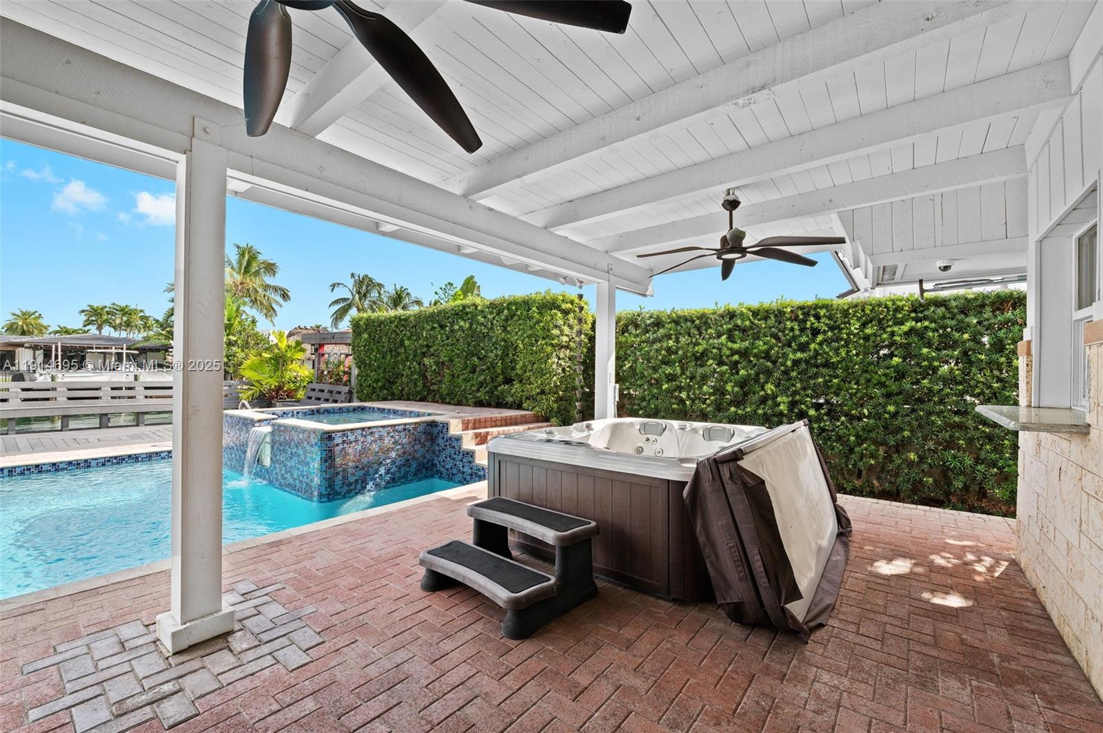 2015 Northeast 120th Road North Miami, FL 33181 - Photo 51 of 67 a view of balcony with couch and chairs