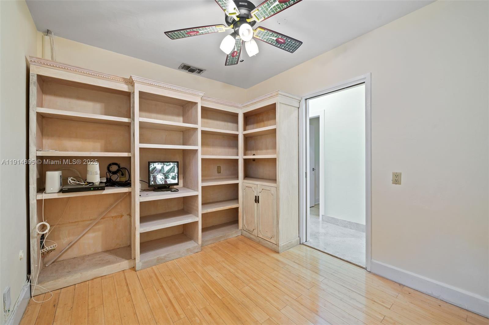2015 Northeast 120th Road North Miami, FL 33181 - Photo 57 of 67 a view of an empty room with a cabinet and a window