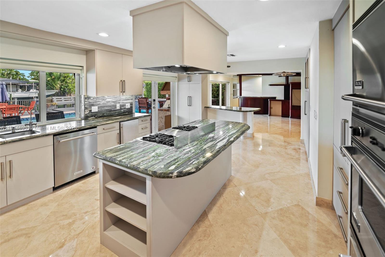 2015 Northeast 120th Road North Miami, FL 33181 - Photo 6 of 67 a kitchen with stainless steel appliances granite countertop a sink stove and refrigerator