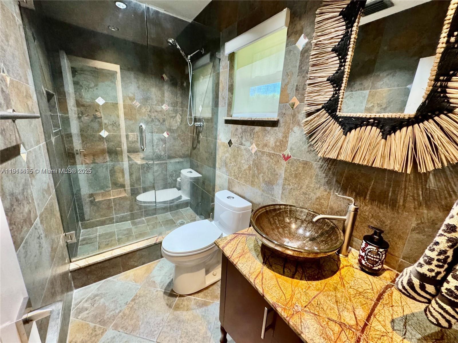 2015 Northeast 120th Road North Miami, FL 33181 - Photo 64 of 67 a bathroom with a toilet and a sink