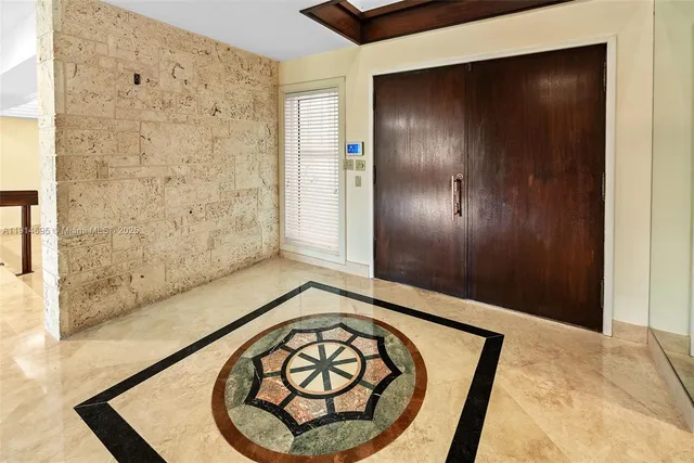 a kitchen with stainless steel appliances granite countertop a stove and a refrigerator