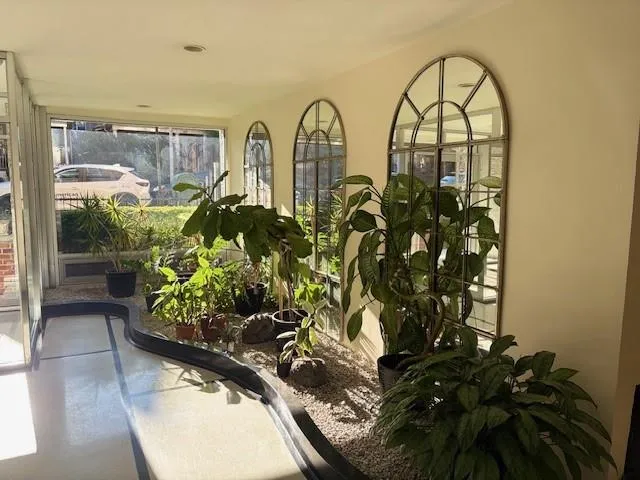 a view of a bunch of flowers in a balcony