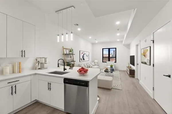 a very nice looking room with a white furniture