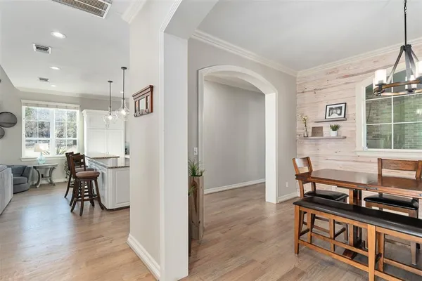 a view of a livingroom with furniture and hardwood floor