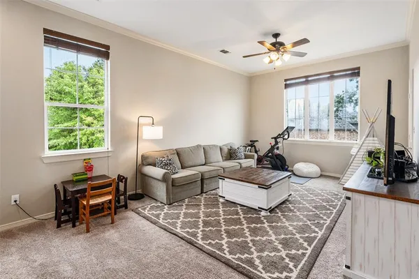 a living room with furniture and a large window