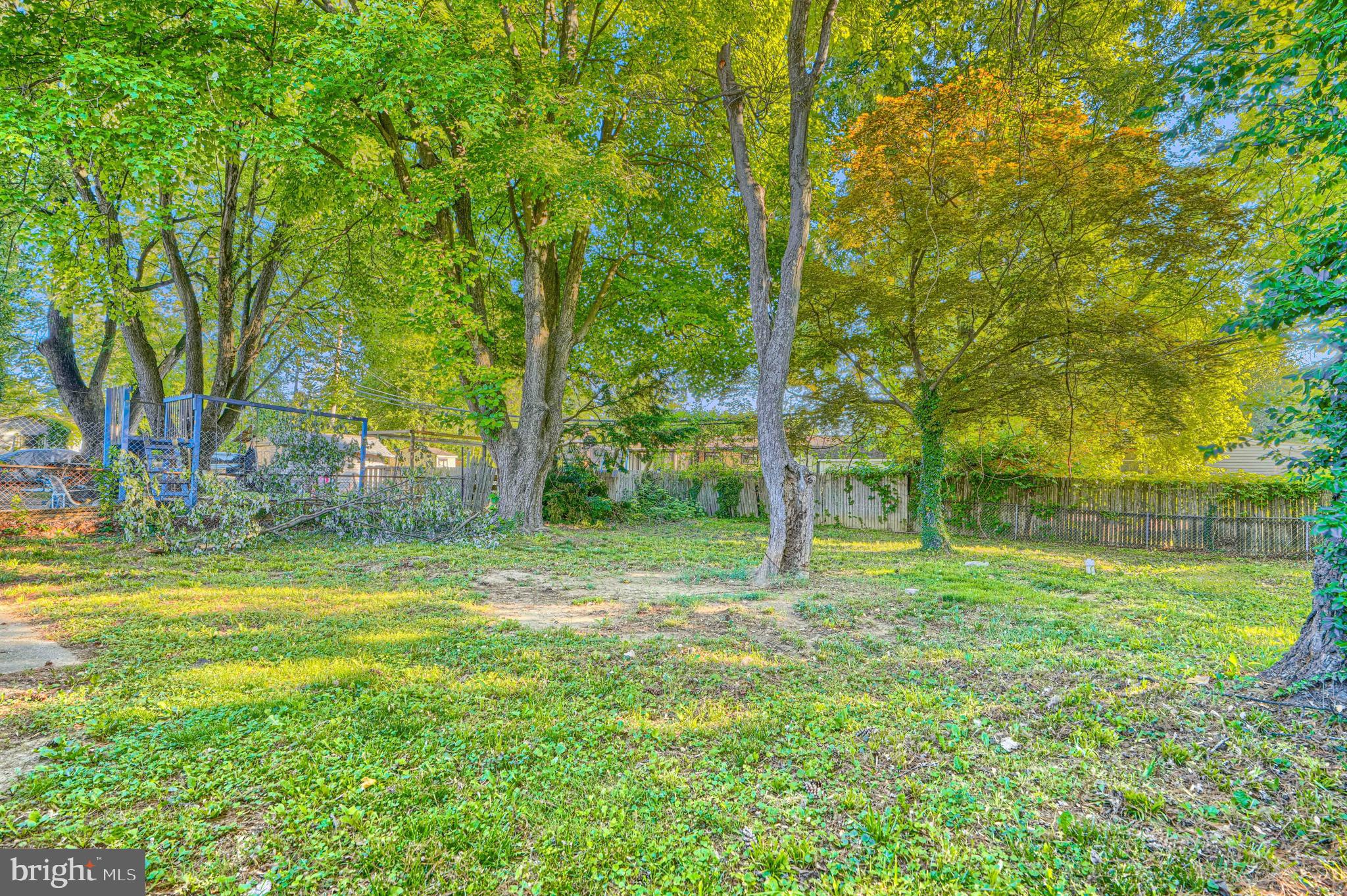 9706 Liberty Road Randallstown, MD 21133 - Photo 4 of 43 a backyard of a house with lots of green space and garden view