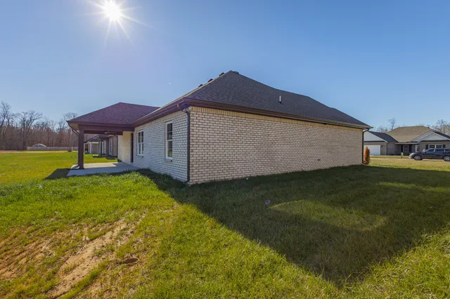 a kitchen with stainless steel appliances granite countertop a sink a stove and a wooden floors