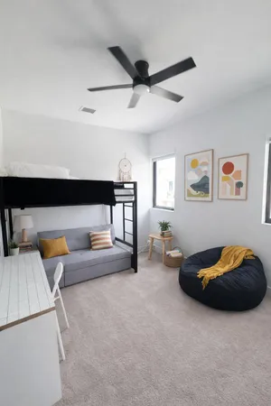 a bedroom with furniture and a couch