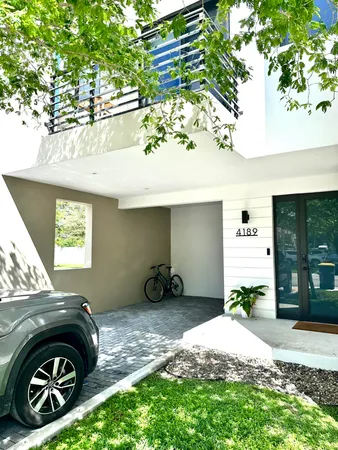 a view of a car in front of a house