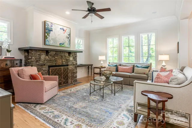 a living room with furniture and a fireplace