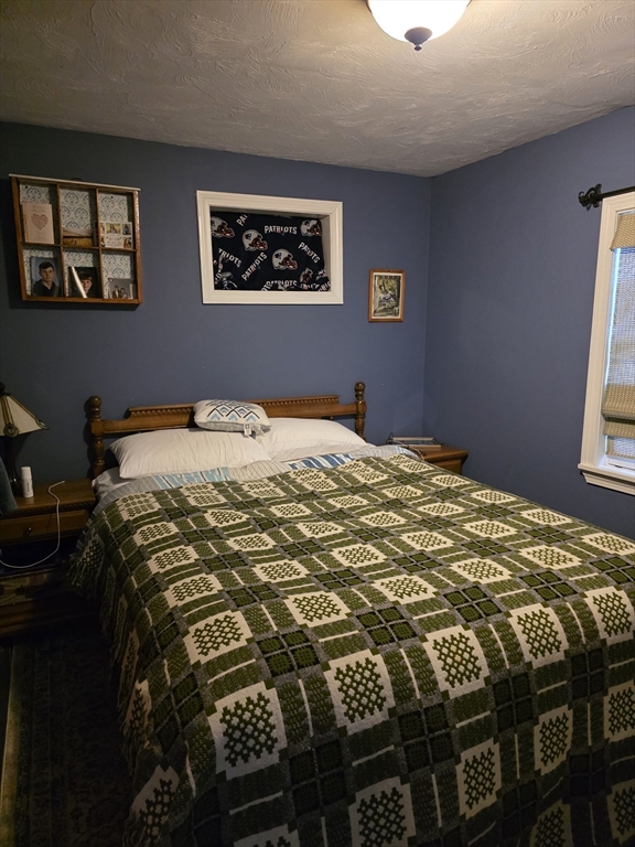 13 Pondview Way Carver, MA 02330 - Photo 11 of 22 a bedroom with a bed and a window