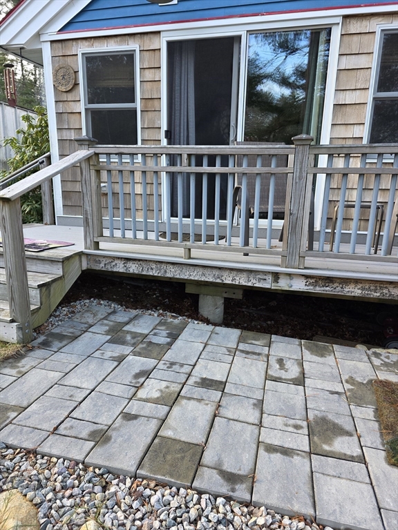 13 Pondview Way Carver, MA 02330 - Photo 21 of 22 a balcony with a table and chairs