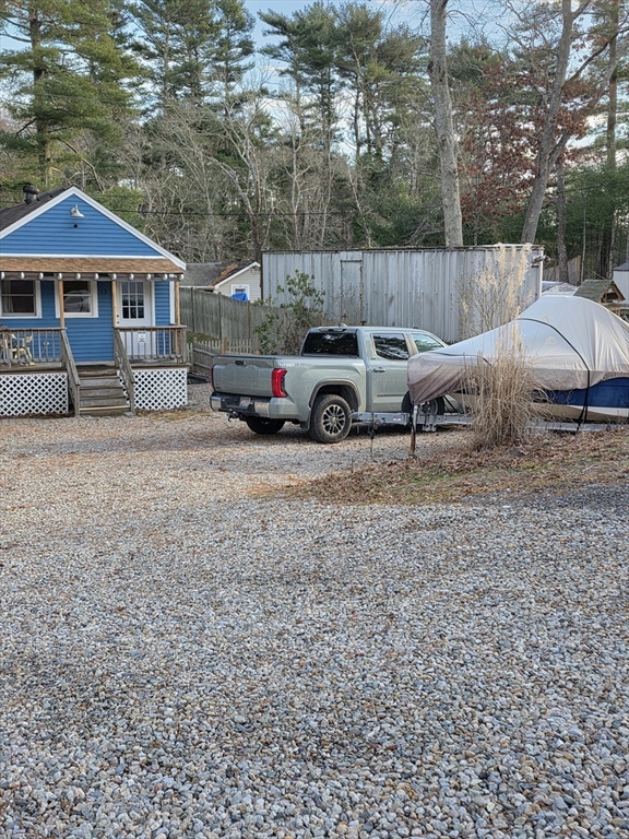 13 Pondview Way Carver, MA 02330 - Photo 3 of 22 a view of a house with backyard and sitting area