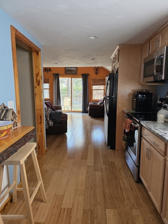 13 Pondview Way Carver, MA 02330 - Photo 8 of 22 a view of a living room with furniture and a flat screen tv