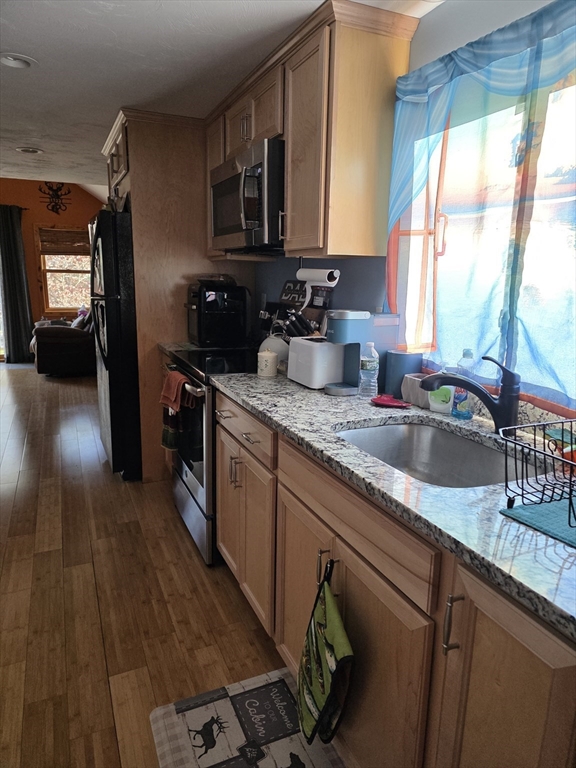 13 Pondview Way Carver, MA 02330 - Photo 10 of 22 a kitchen with stainless steel appliances granite countertop a sink stove and cabinets