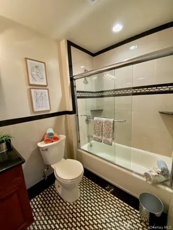 a bathroom with a toilet a sink and a shower