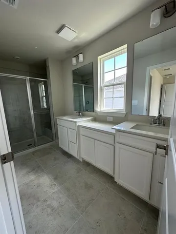 an empty room with closet and mirror