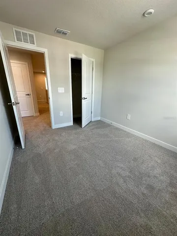 a bathroom with a double vanity sink toilet mirror and bathtub