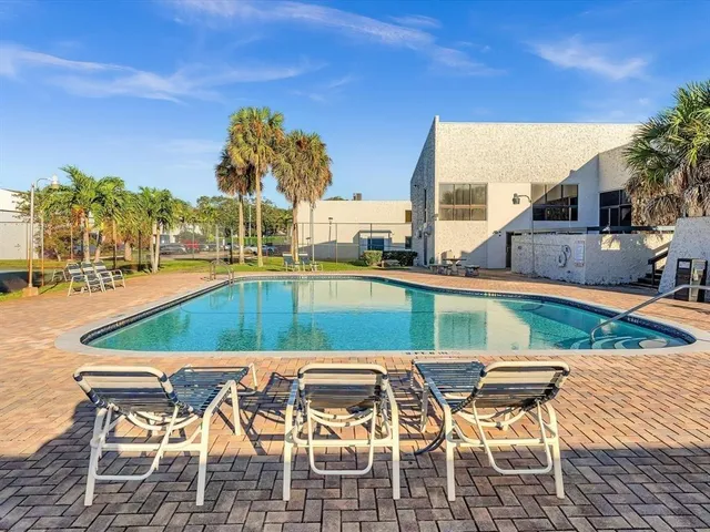 a view of an chairs and tables in the patio