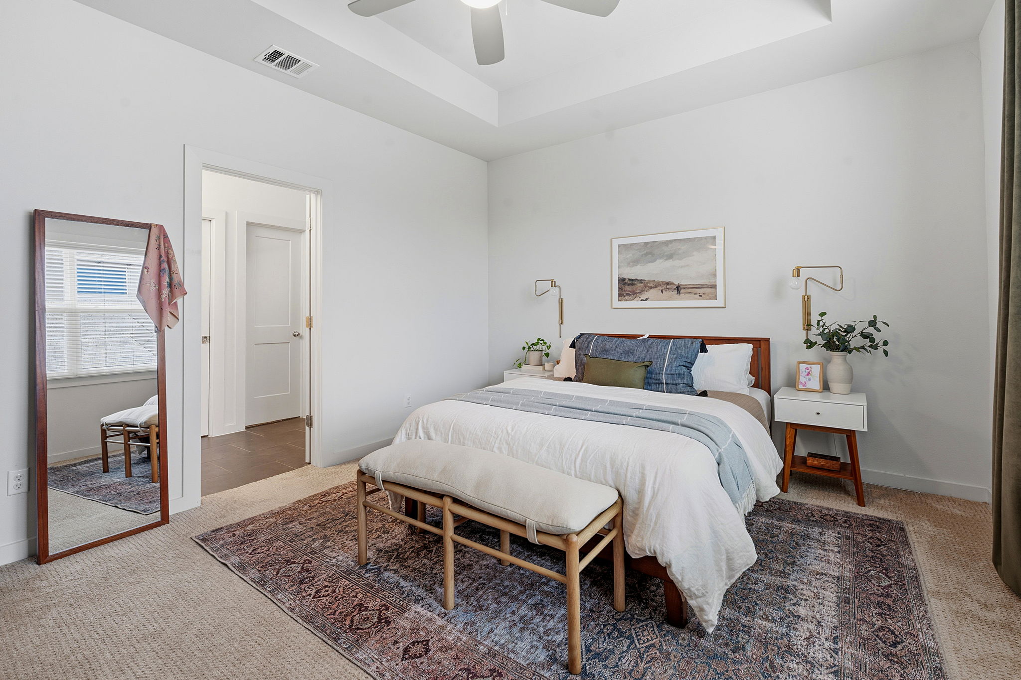 900 Old Mill Road, Unit 46 Cedar Park, TX 78613 - Photo 14 of 30 Carpeted bedroom with a tray ceiling and a ceiling fan
