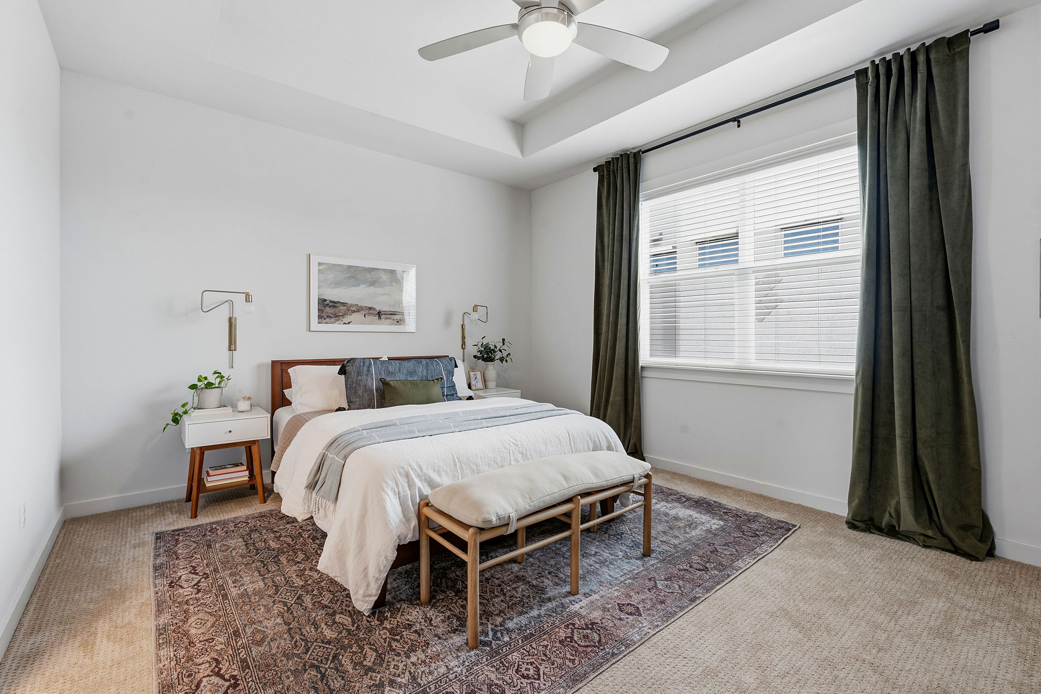 900 Old Mill Road, Unit 46 Cedar Park, TX 78613 - Photo 15 of 30 Bedroom with light colored carpet, a ceiling fan, and a tray ceiling