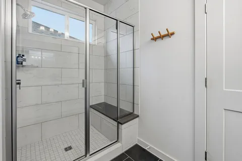 a en suite bathroom with double sink and a mirror