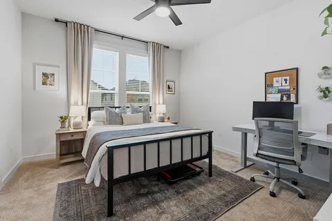 a white toilet sitting next to a bathroom sink