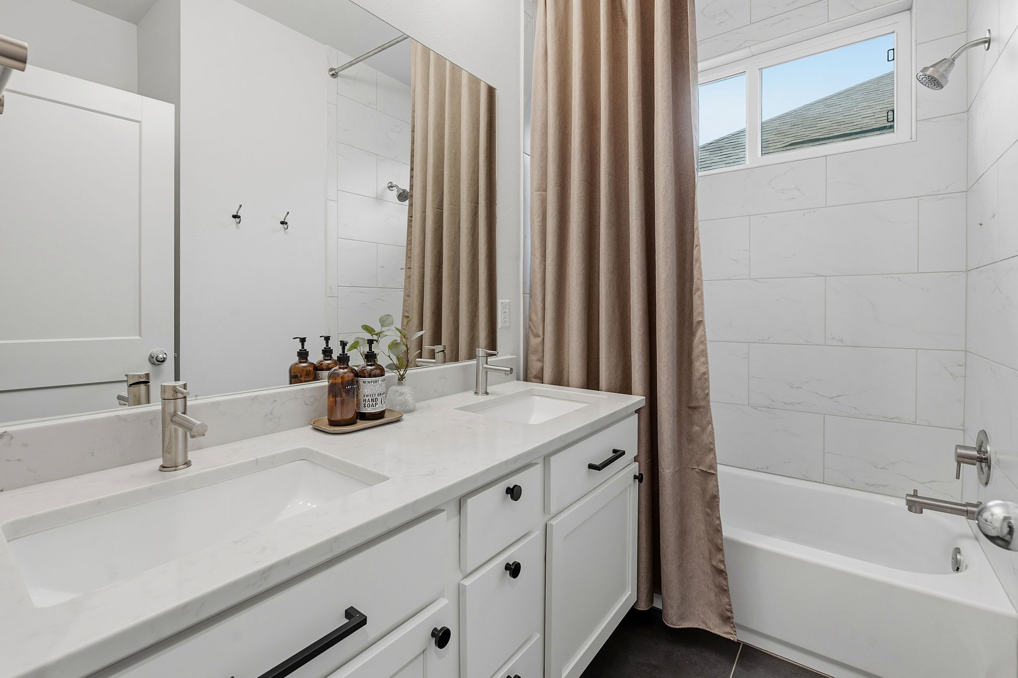 900 Old Mill Road, Unit 46 Cedar Park, TX 78613 - Photo 22 of 30 Bathroom with double vanity and shower / bathtub combination with curtain
