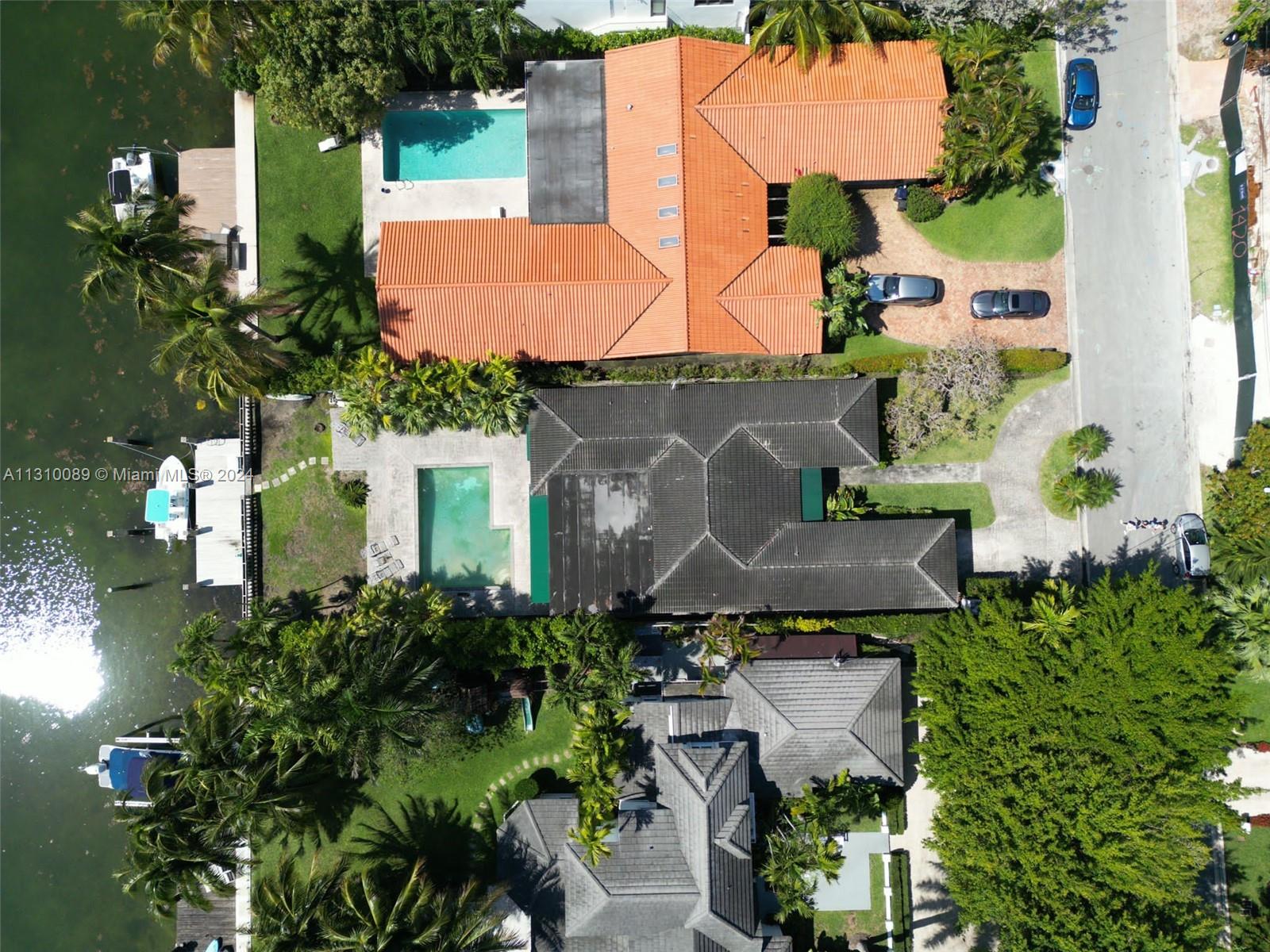 1429 Biscaya Drive Surfside, FL 33154 - Photo 2 of 6 an aerial view of multiple houses with yard