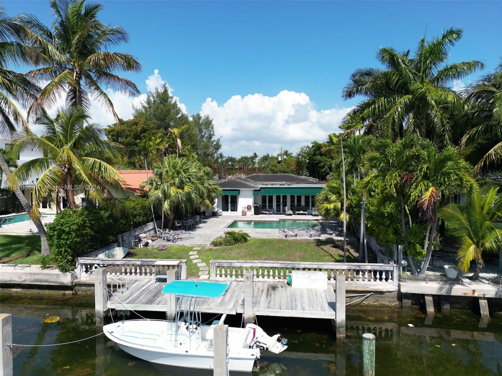 1429 Biscaya Drive Surfside, FL 33154 - Photo 3 of 6 a view of house with swimming pool and patio