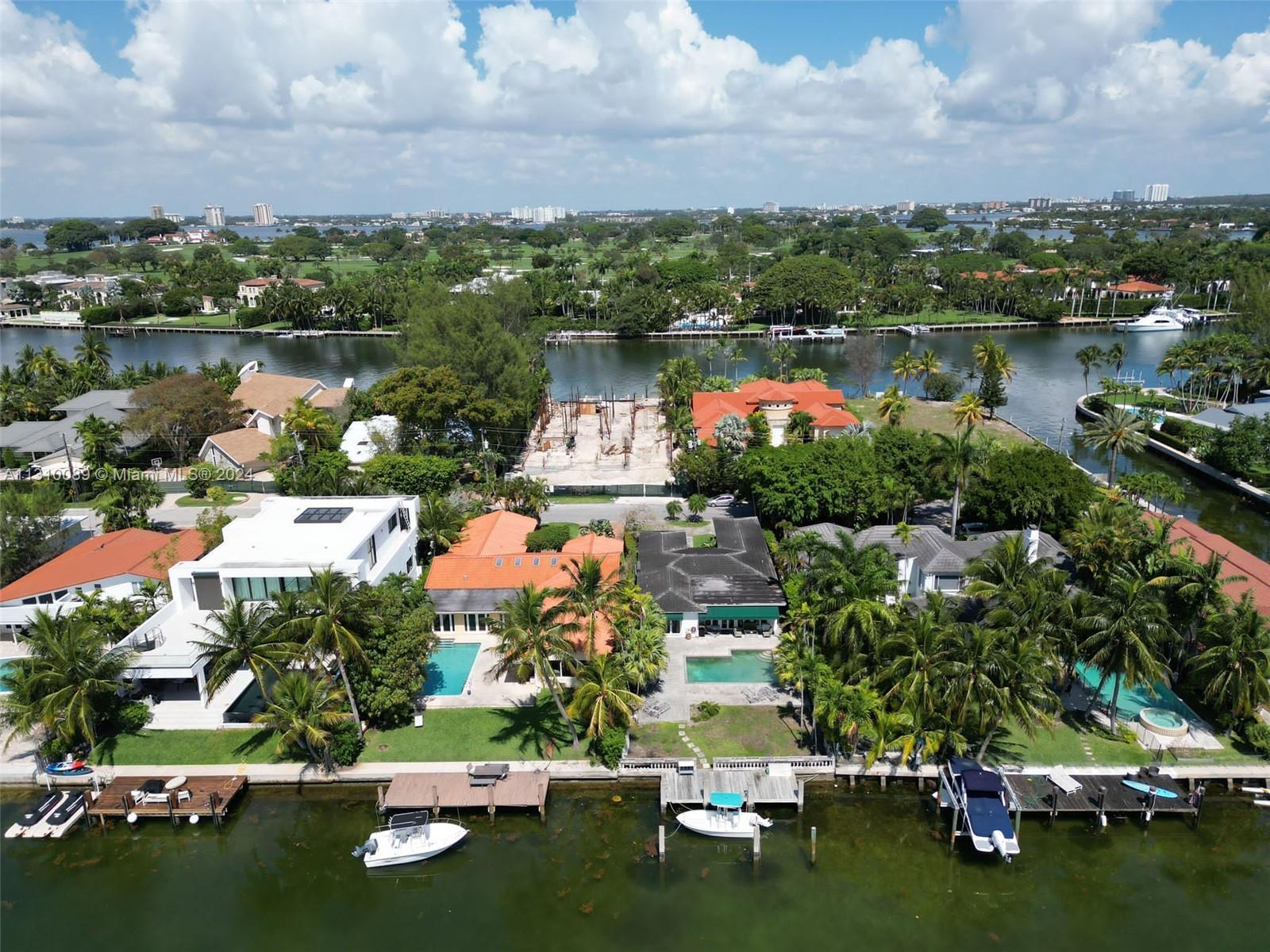 1429 Biscaya Drive Surfside, FL 33154 - Photo 4 of 6 an aerial view of residential houses with outdoor space and lake view