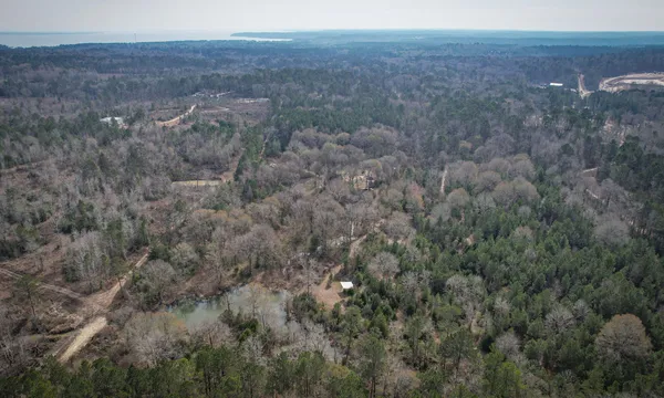 a view of a lake with a yard