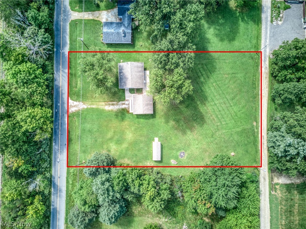 6503 Garrett Road Ravenna, OH 44266 - Photo 45 of 50 Expansive parcel featuring a main residence, an accessory structure, mature trees, and a substantial grassy area