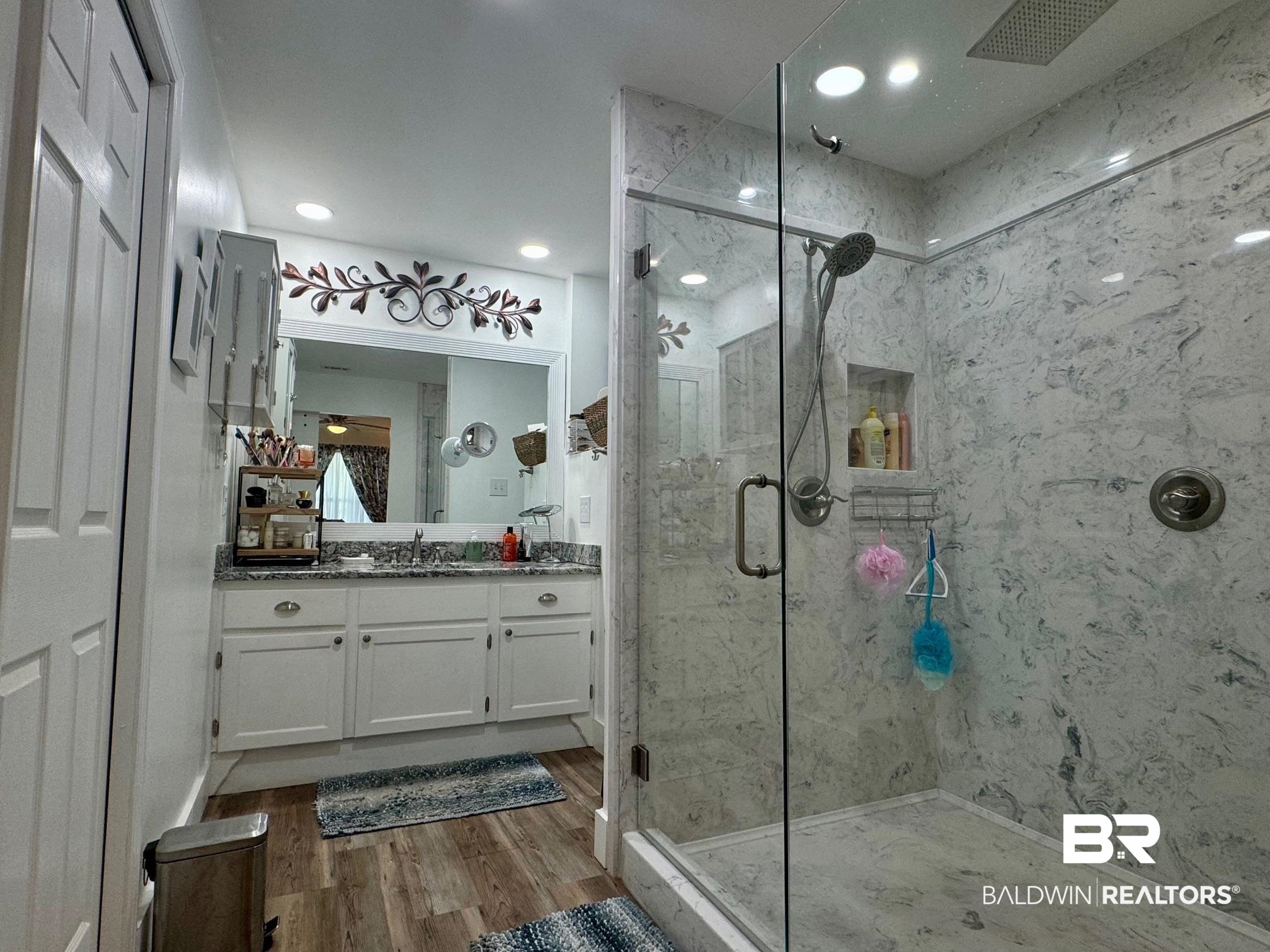 3200 Loop Road, Unit 55 Orange Beach, AL 36561 - Photo 17 of 40 Bathroom with vanity, walk in shower, and wood-type flooring