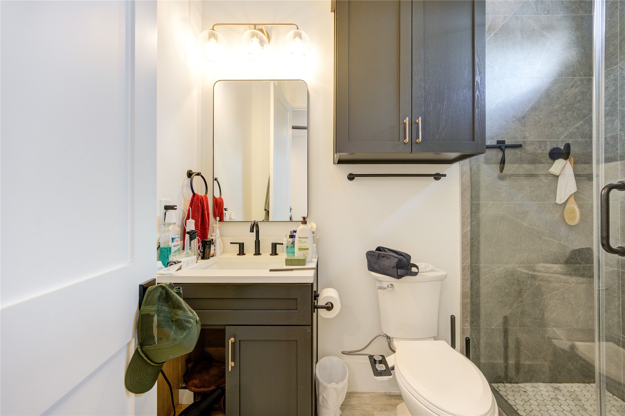 18 Sidney Street, Unit A Houston, TX 77003 - Photo 25 of 30 a bathroom with a sink vanity mirror and toilet