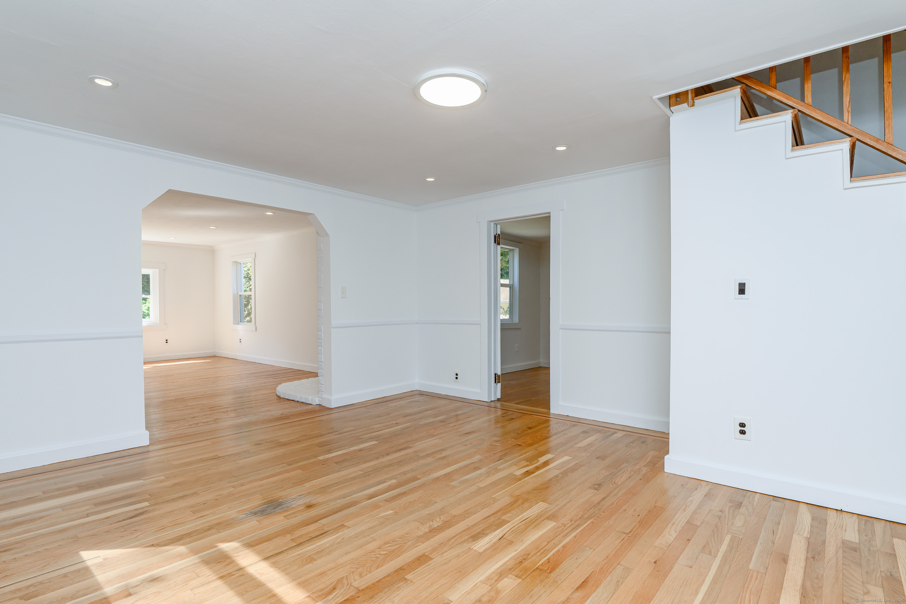 81 Picketts Ridge Road Redding, CT 06896 - Photo 11 of 28 a view of an empty room and wooden floor