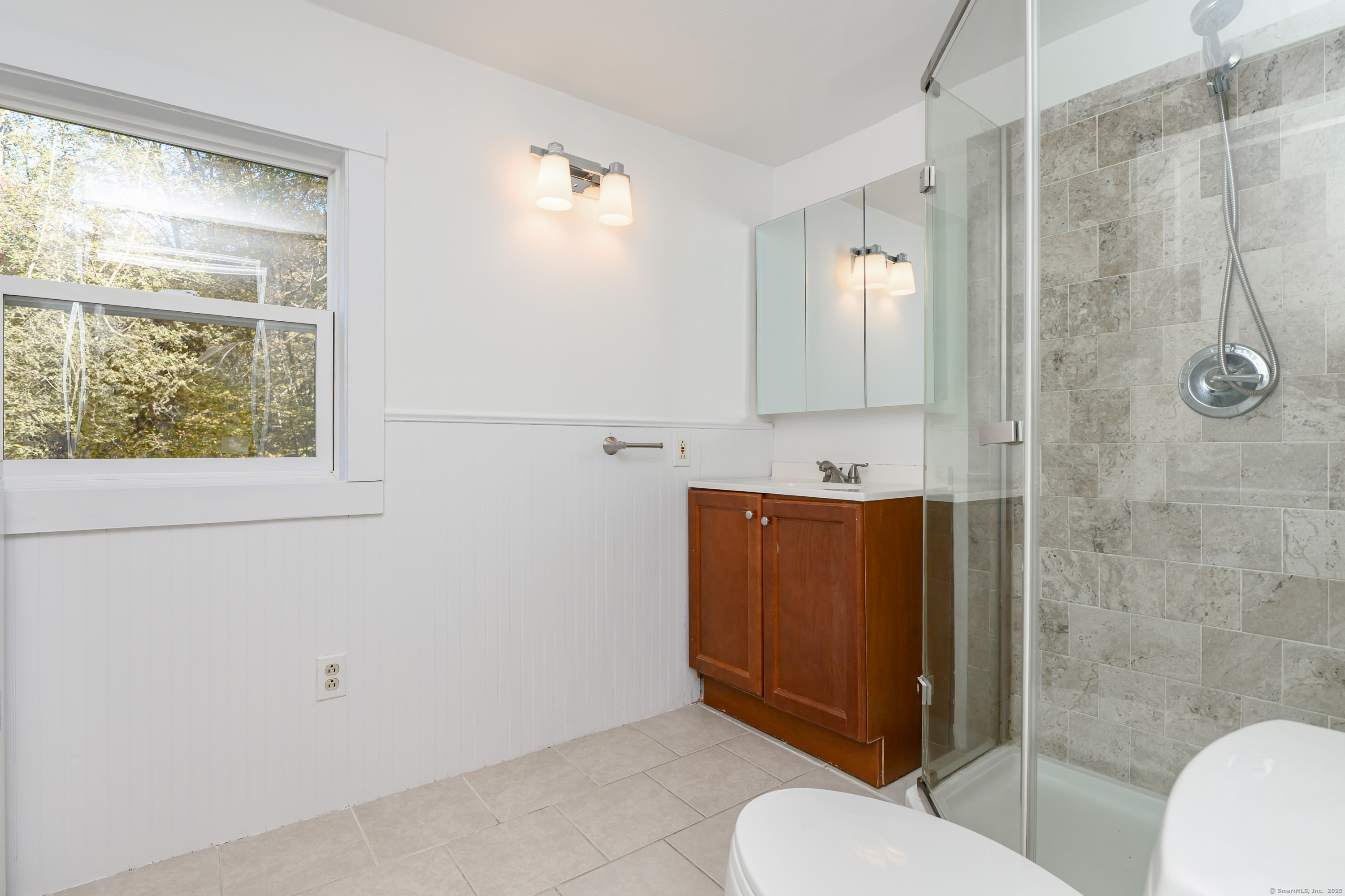 81 Picketts Ridge Road Redding, CT 06896 - Photo 16 of 28 a bathroom with a sink toilet and shower