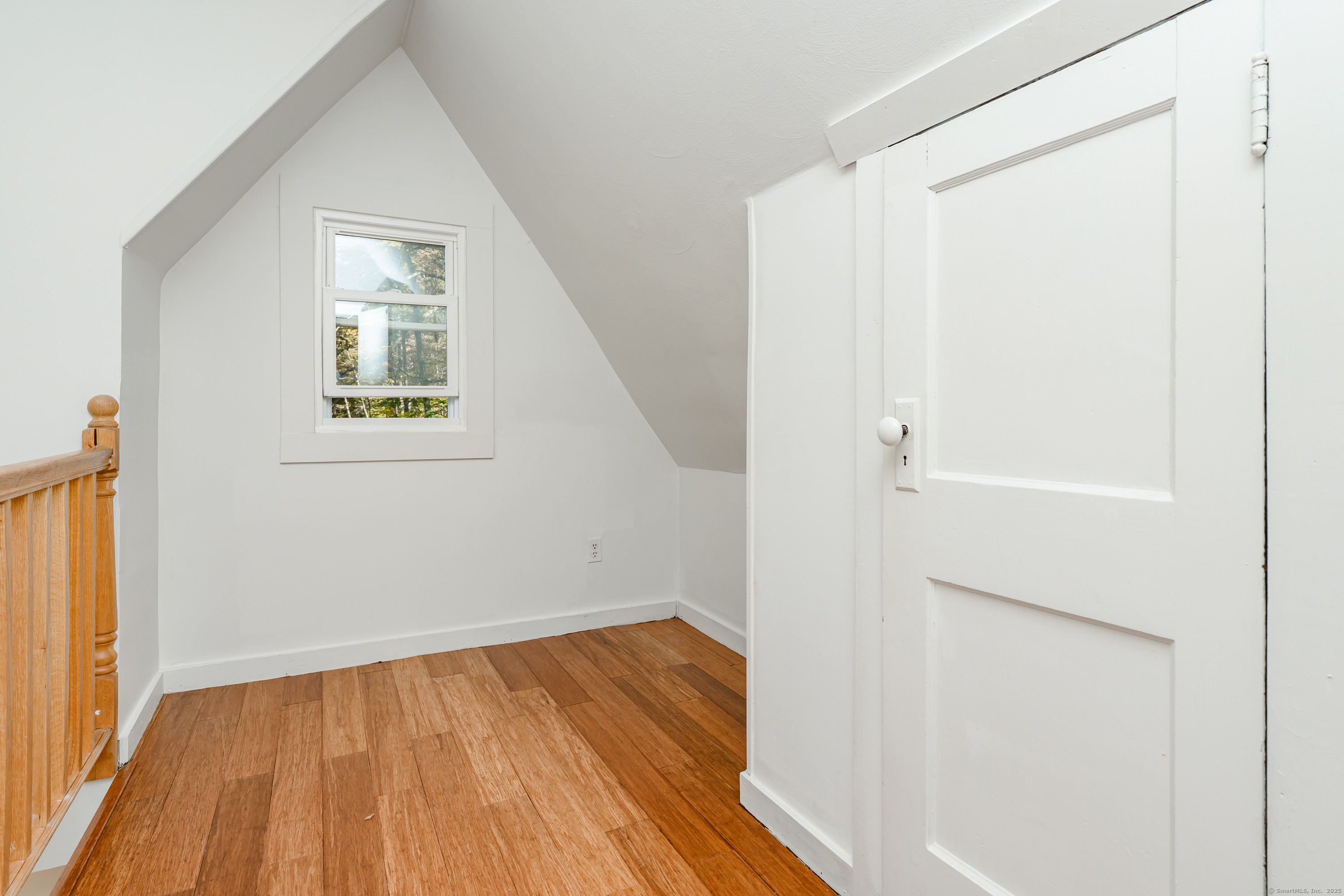81 Picketts Ridge Road Redding, CT 06896 - Photo 18 of 28 a view of a room that has wooden floor and a window