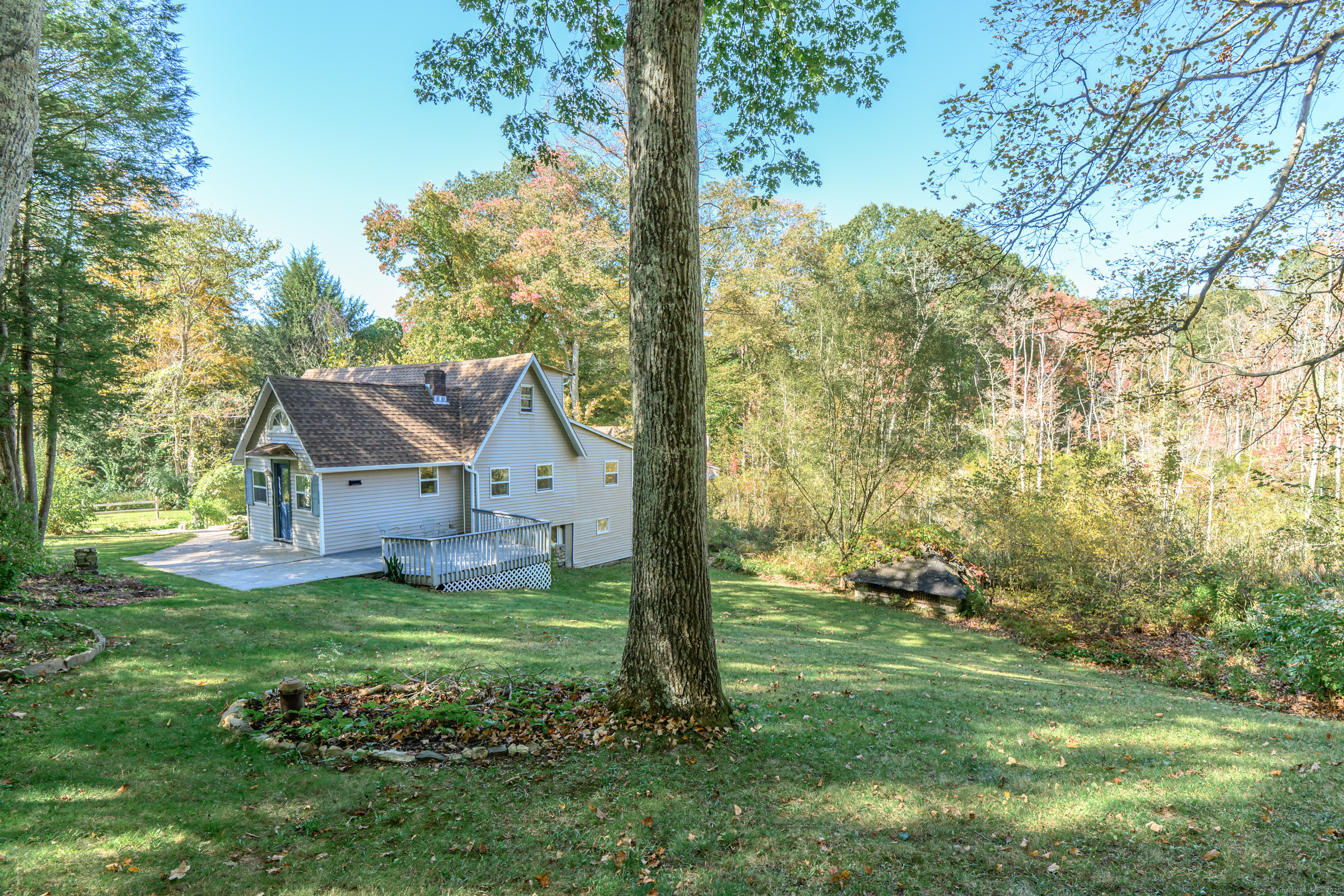 81 Picketts Ridge Road Redding, CT 06896 - Photo 5 of 28 a front view of a house with a yard