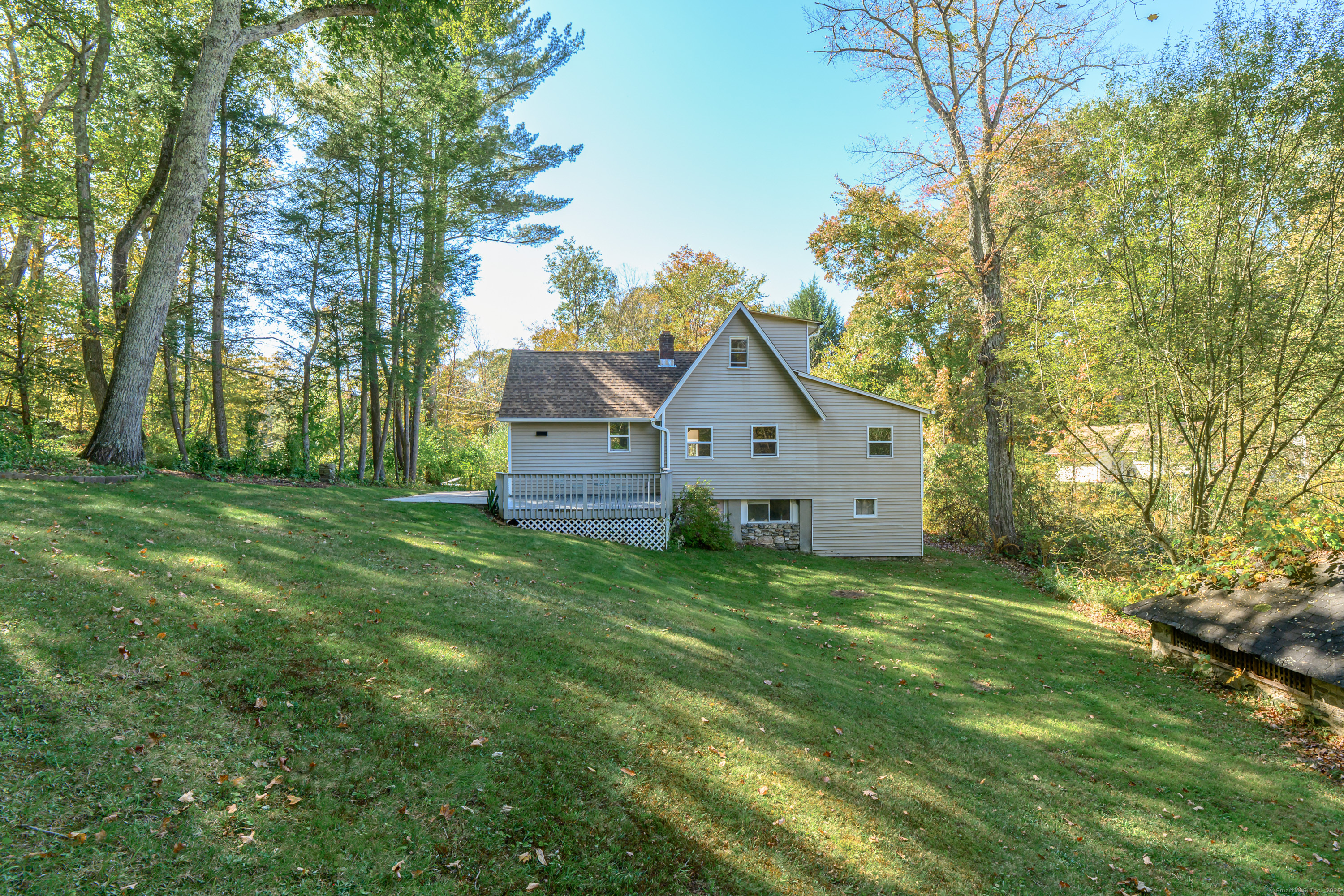 81 Picketts Ridge Road Redding, CT 06896 - Photo 6 of 28 a front view of house with yard and green space