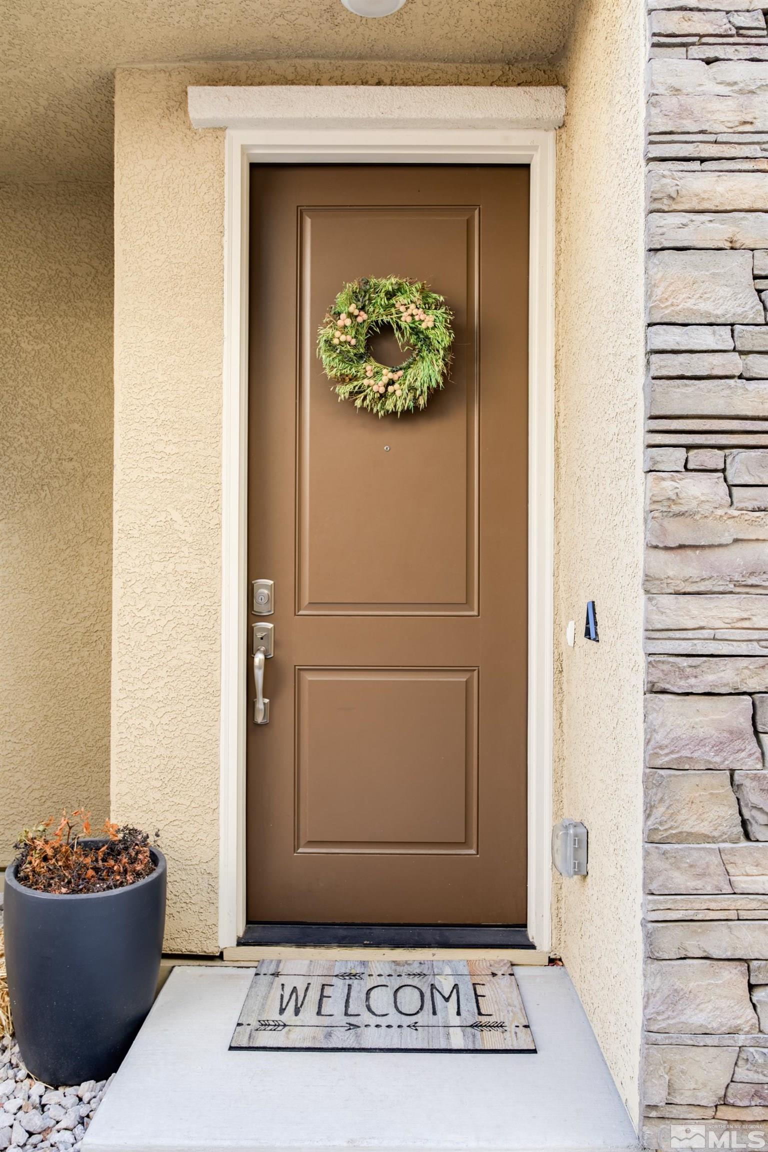 1864 Sea Horse Road, Unit A Reno, NV 89521 - Photo 3 of 17 a view of a entryway door of the house