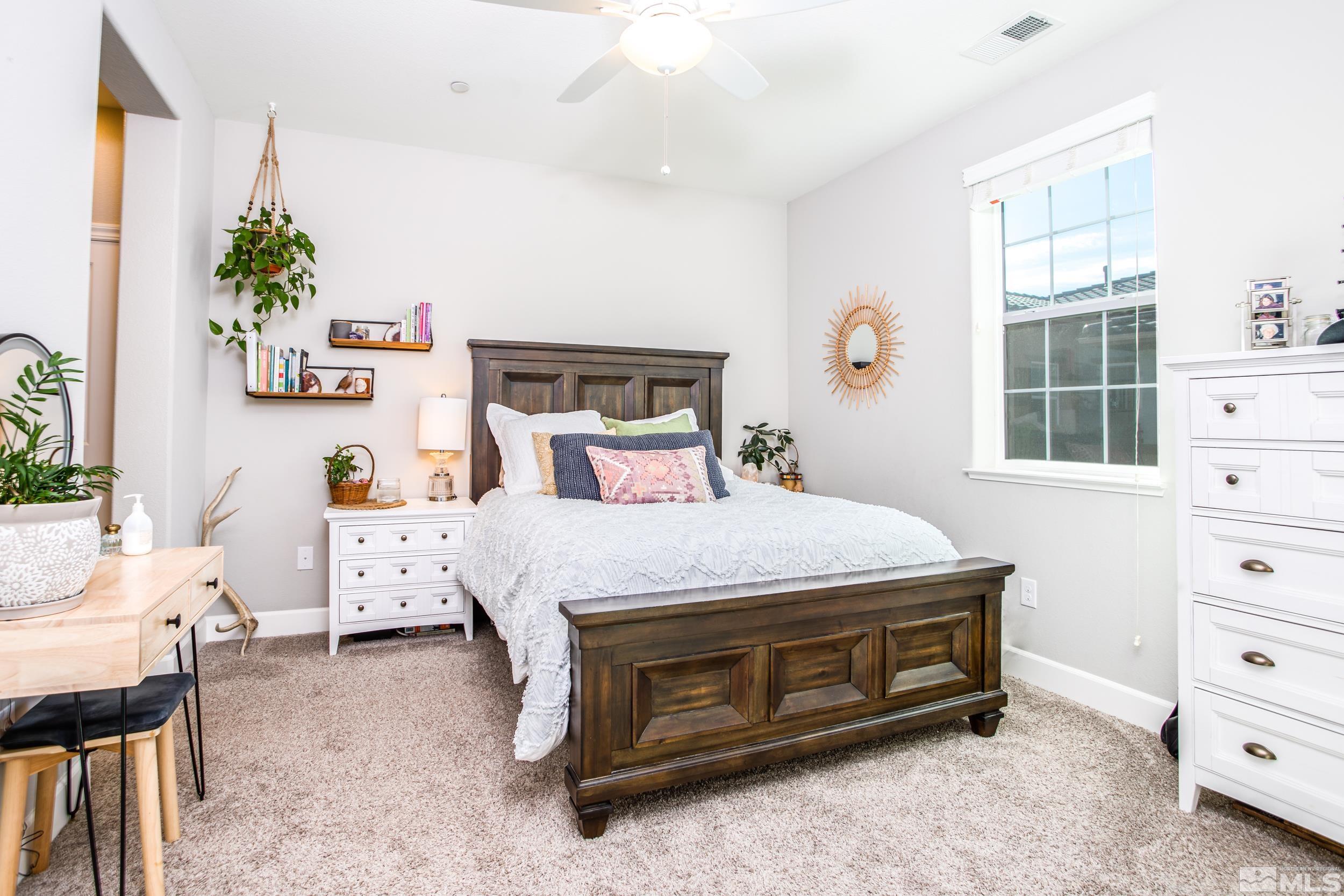 1864 Sea Horse Road, Unit A Reno, NV 89521 - Photo 9 of 17 a bedroom with a bed and a window