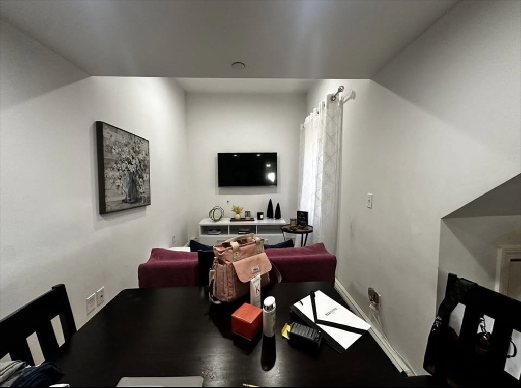 69 Beacon Street, Unit 3 Chelsea, MA 02150 - Photo 3 of 9 a livingroom with workspace and a couch