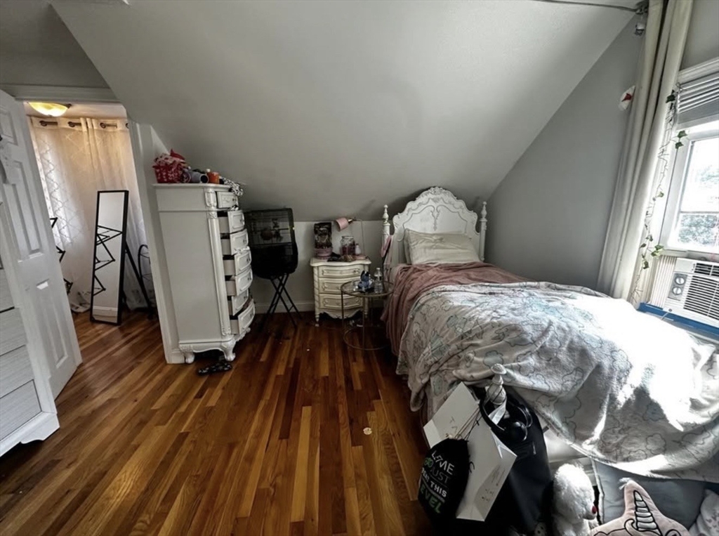 69 Beacon Street, Unit 3 Chelsea, MA 02150 - Photo 4 of 9 a bed sitting in a bedroom next to a window