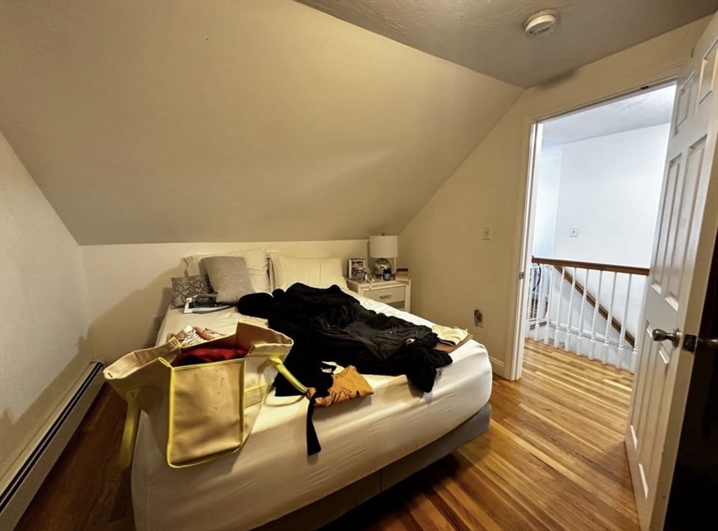 69 Beacon Street, Unit 3 Chelsea, MA 02150 - Photo 6 of 9 a bedroom with bed and window