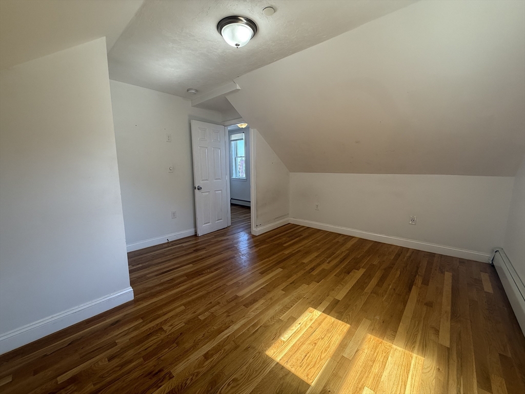 69 Beacon Street, Unit 3 Chelsea, MA 02150 - Photo 6 of 9 a view of empty room with wooden floor