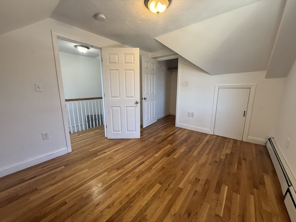 69 Beacon Street, Unit 3 Chelsea, MA 02150 - Photo 8 of 9 wooden floor in an empty room